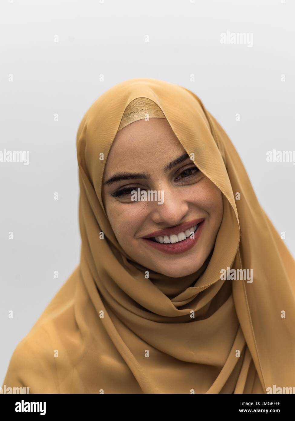 Portrait of young muslim woman wearing hijab on isolated white ...