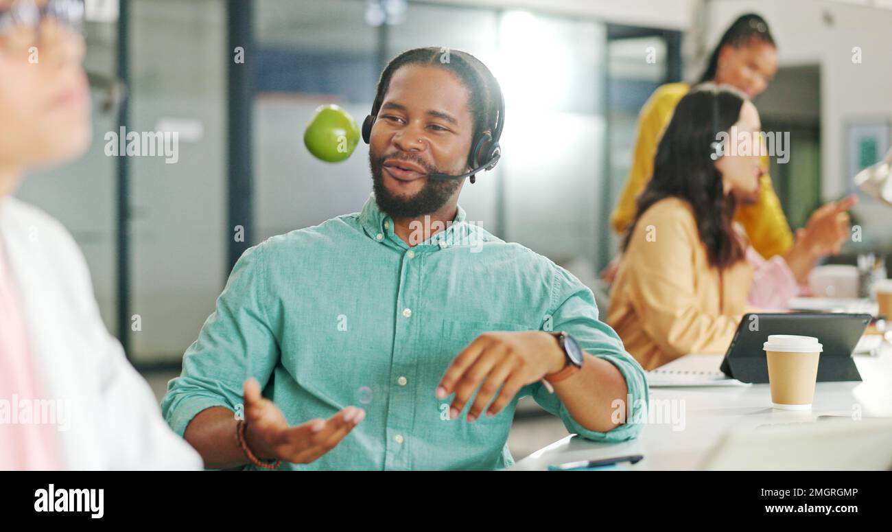 Call center, consulting or black business man with apple on computer for telemarketing, customer service contact us. Communication, sales or crm Stock Photo