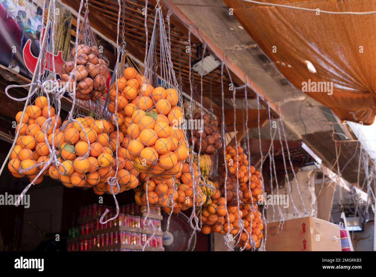 Natural oranges hanged in traditional street market in north Africa, poor country Stock Photo