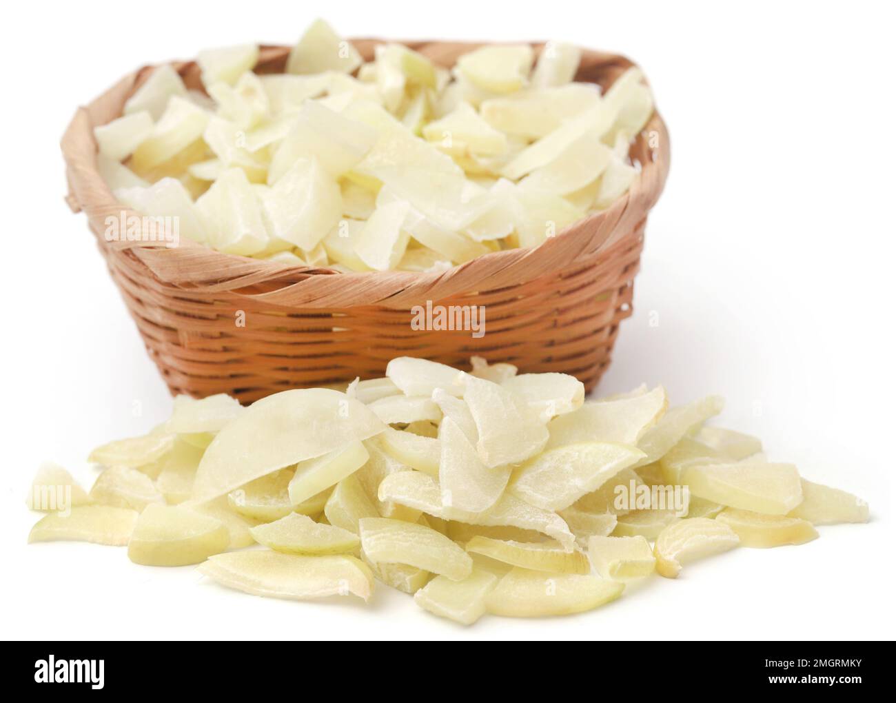 Sliced amla fruits in a bowl over white background Stock Photo