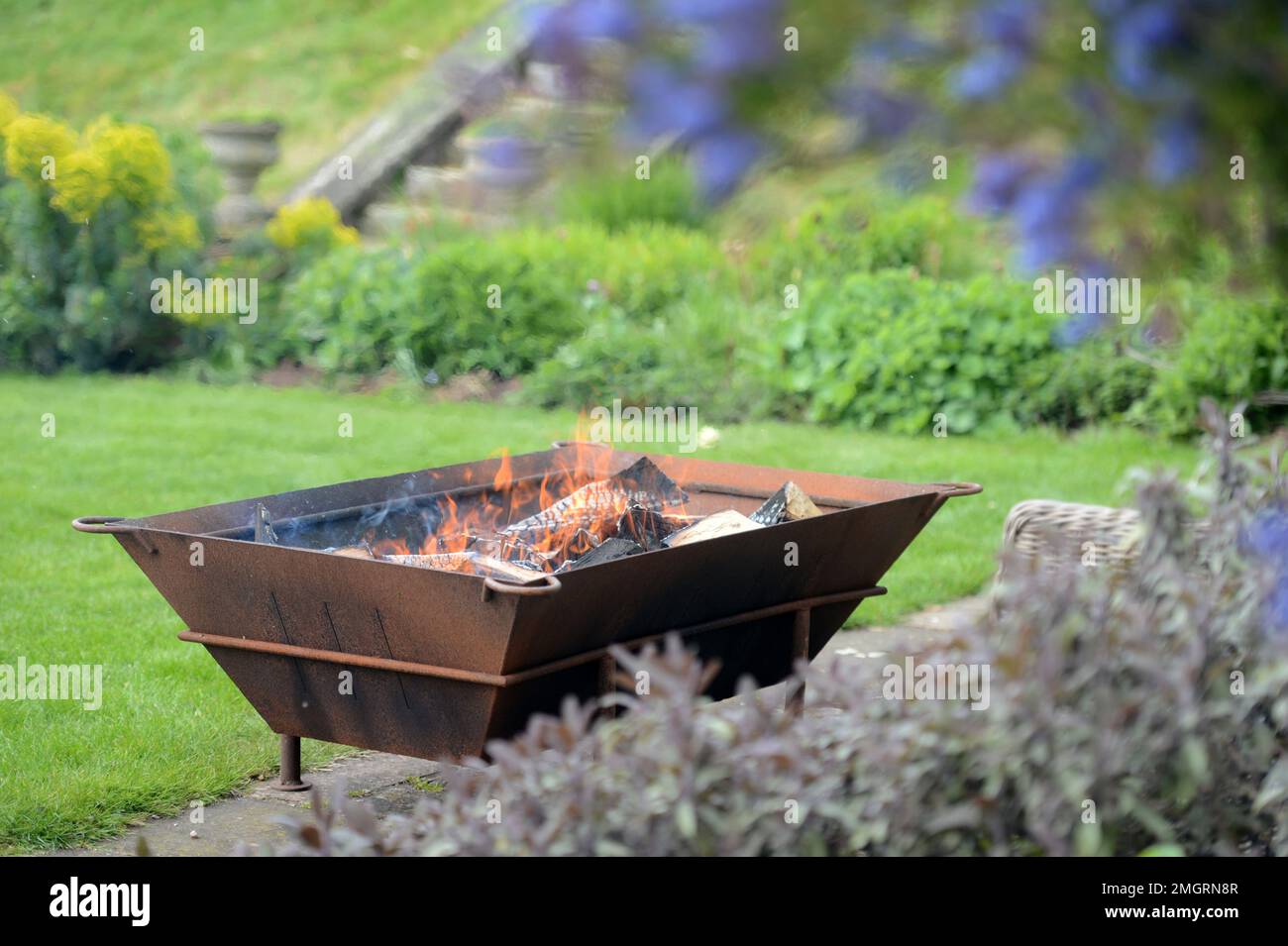 Country house with a fire pit on the terrace. Stock Photo