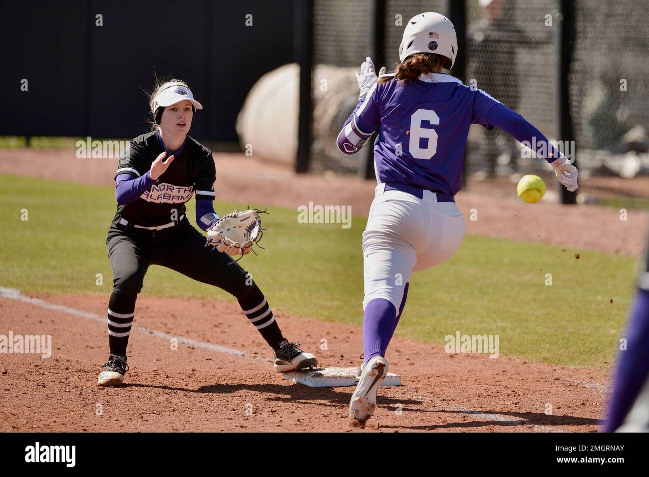 North Alabama's Emma Latham, left, catches ahead of Evansville's Kat during an NCAA softball game on Friday, Feb. 28, 2020 in Memphis, Tenn. (AP Photo/Brandon Dill Stock Photo - Alamy