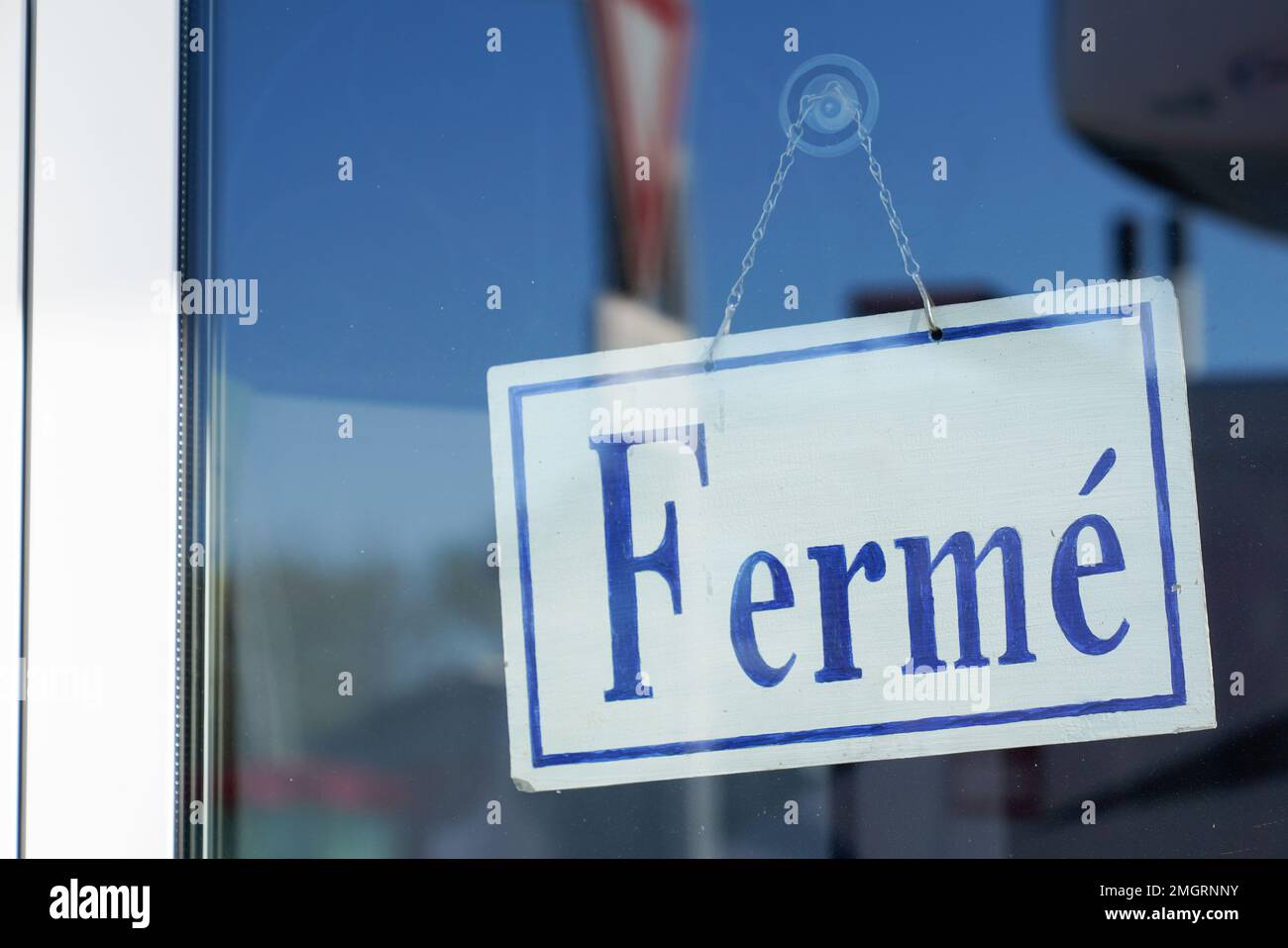 closed french text means ferme on door boutique text sign board on