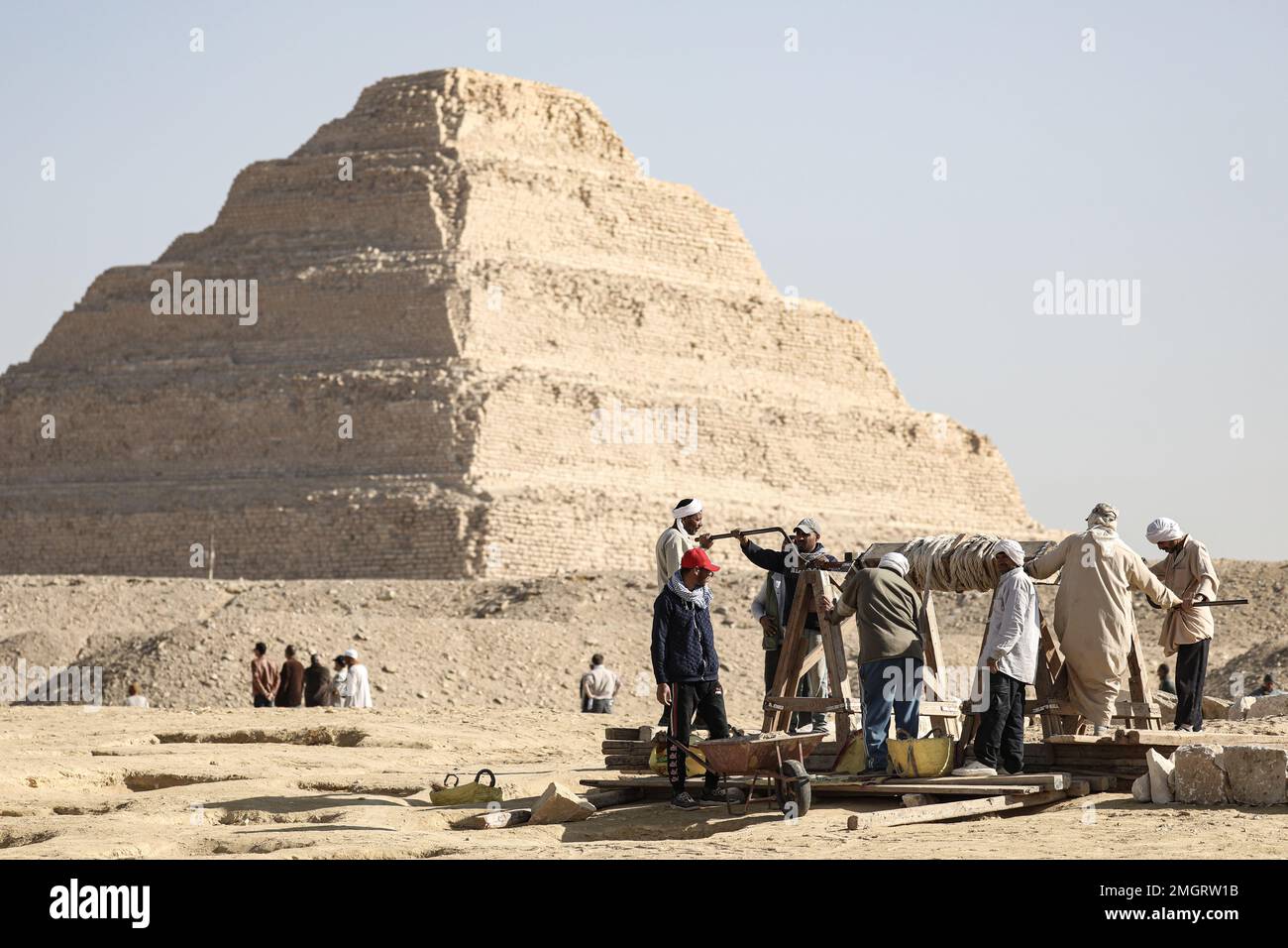 Giza, Egypt. 26th Jan, 2023. Egyptian antiquities workers dig at the