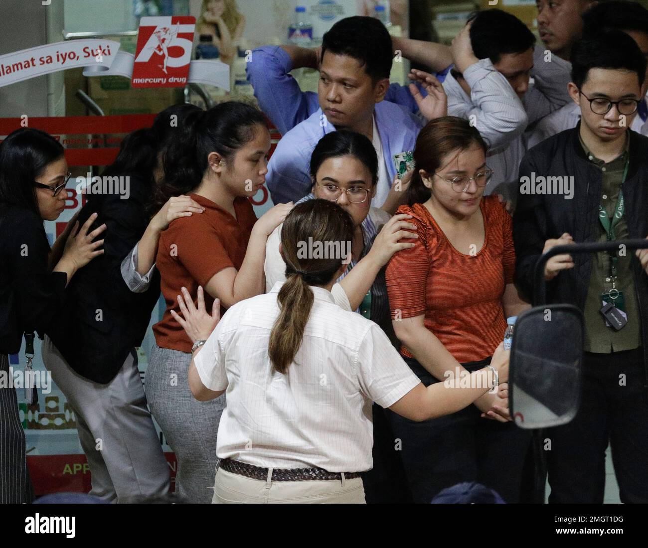 Hostages react as they walk out at the V-mall in Manila, Philippines ...