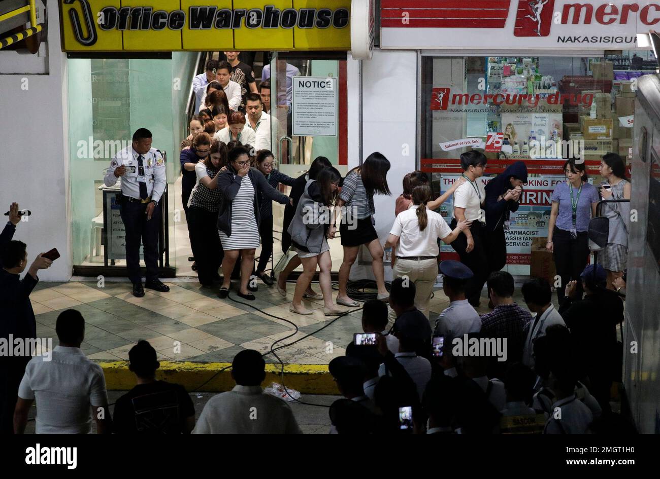 Hostages walk out at the V-mall in Manila, Philippines on Monday, March ...