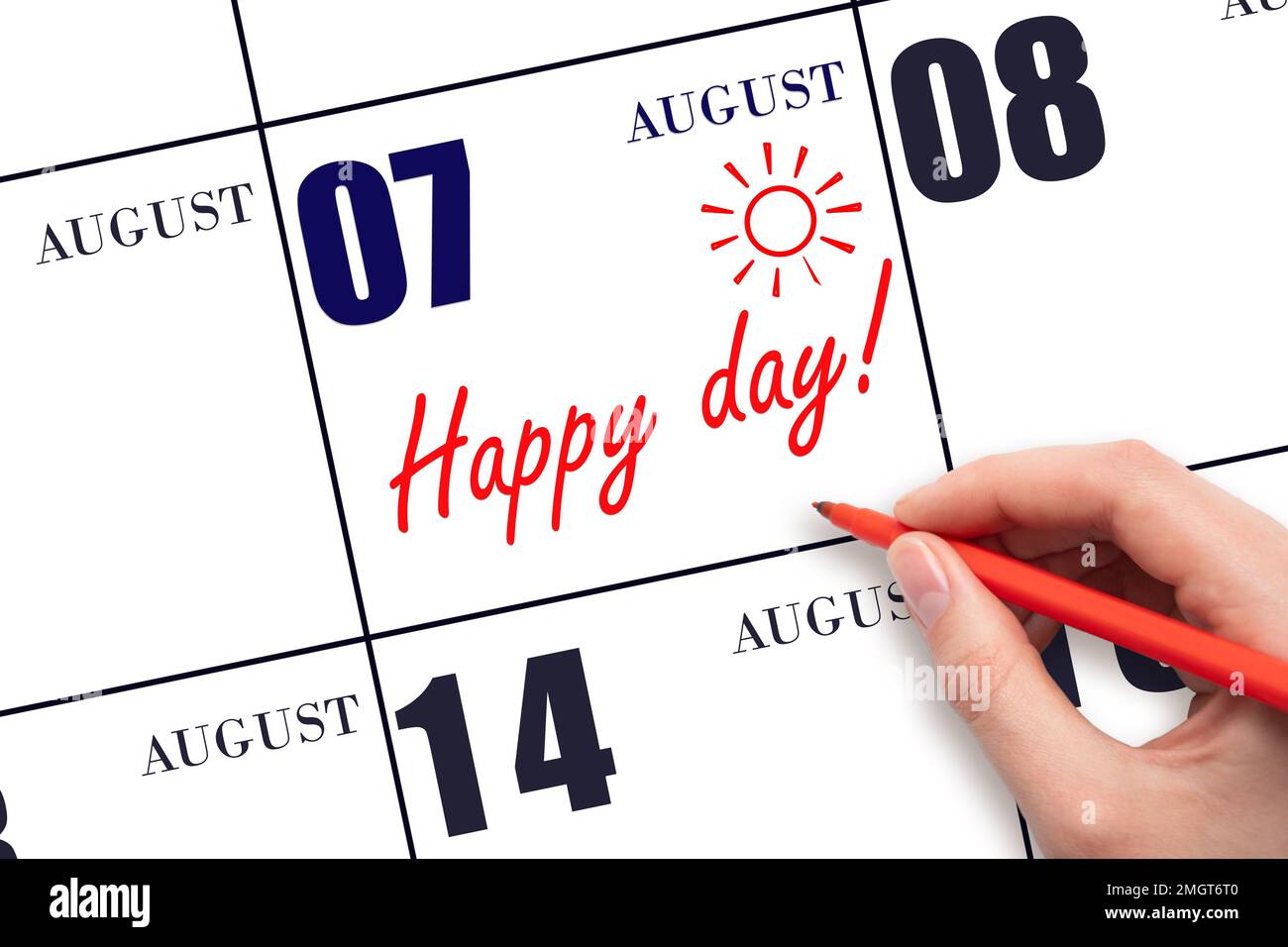 7th day of August. Hand writing the text HAPPY DAY and drawing the sun on the calendar date August 7. Save the date. Holiday. Motivation. Summer month Stock Photo