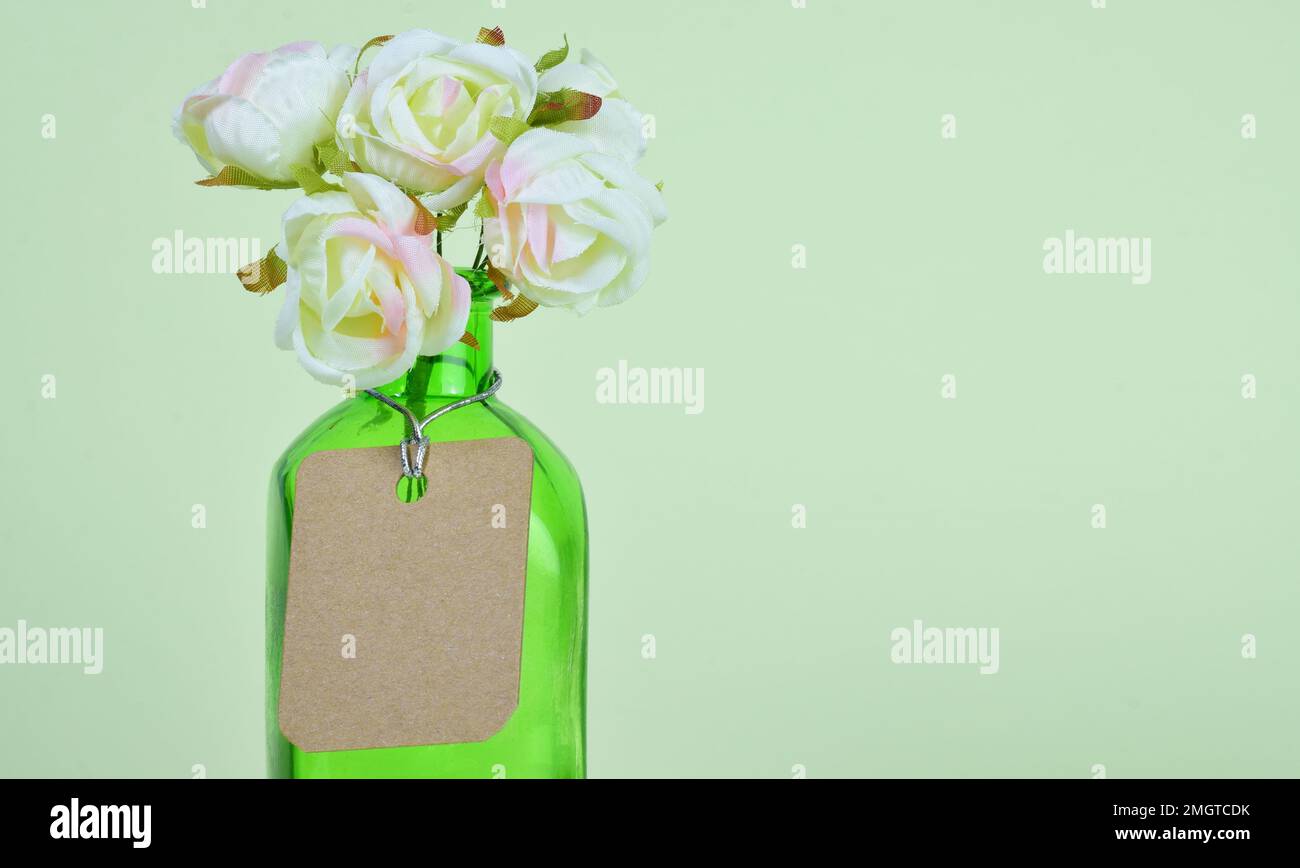 Glass Container With Roses A glass container with a small bouquet of fabric roses Stock Photo - Alamy
