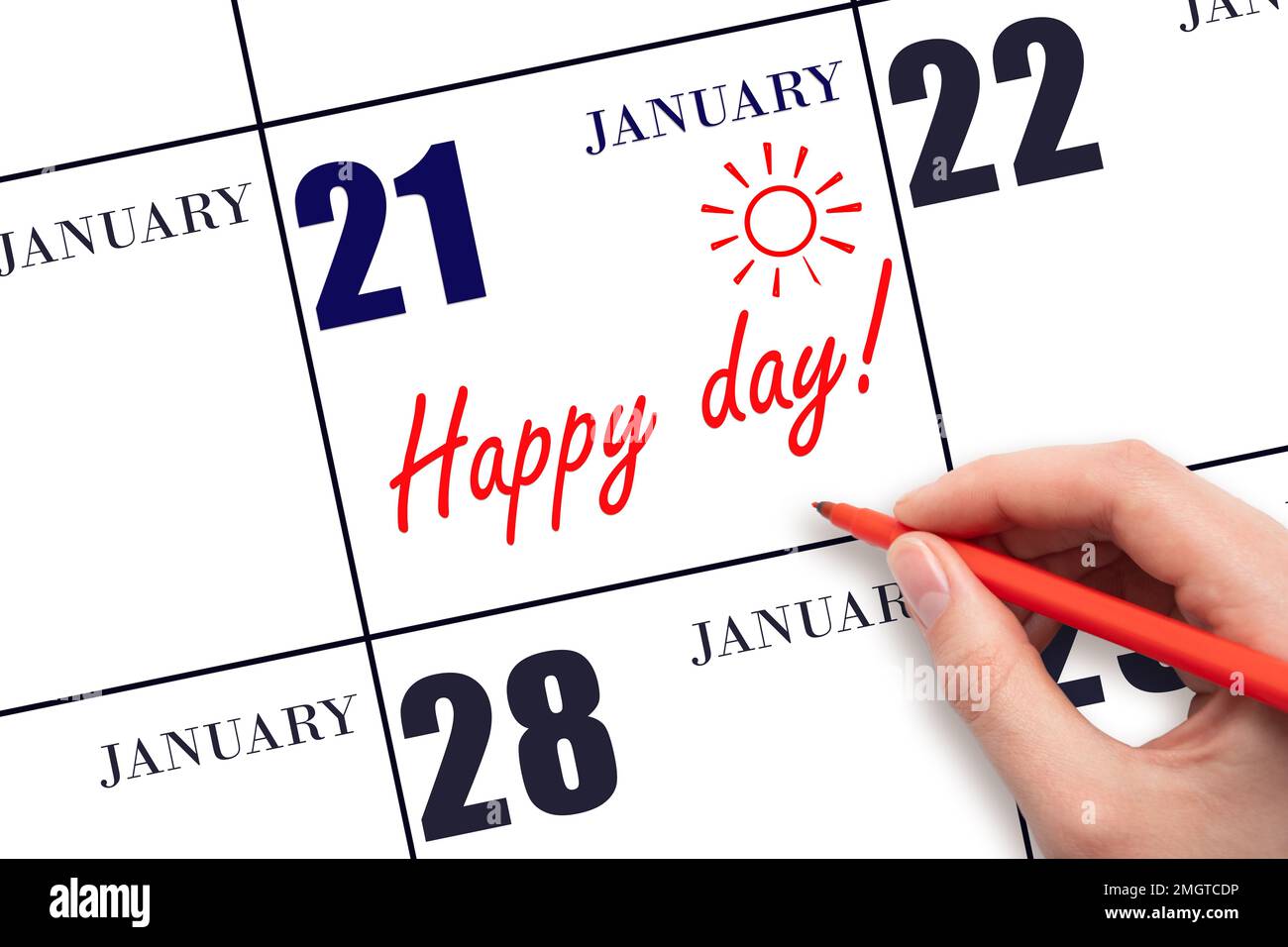 21st day of January. Hand writing the text HAPPY DAY and drawing the sun on the calendar date January 21. Save the date. Holiday. Motivation. Winter m Stock Photo