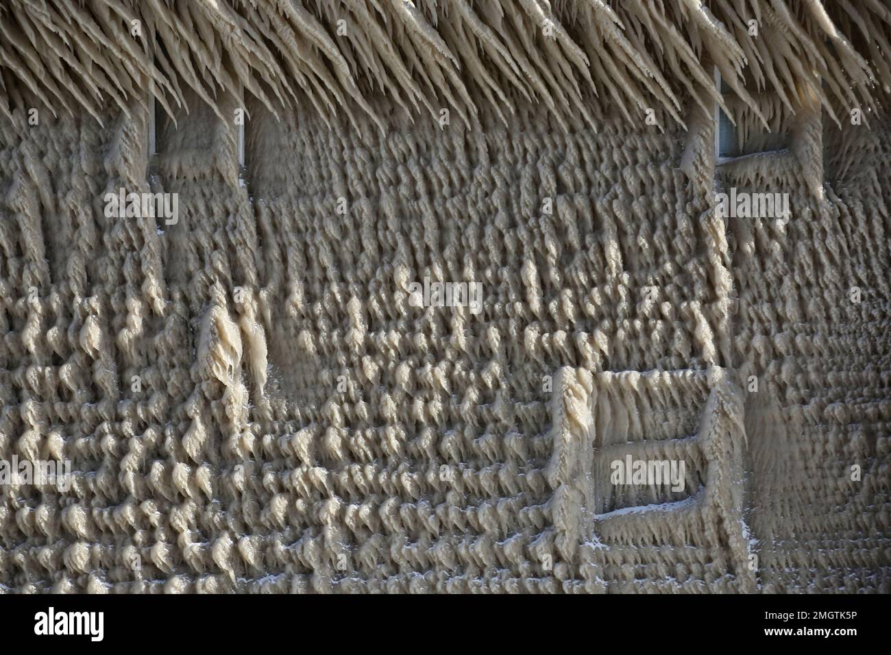 Houses along Hoover Beach are covered by ice from high winds and