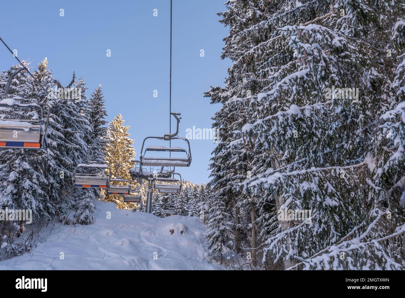 modern ski lifts - monocable circulating ropeway - Andalo village, Adamello Brenta Natural Park, Trentino Alto Adige, northern Italy, Europe - january Stock Photo