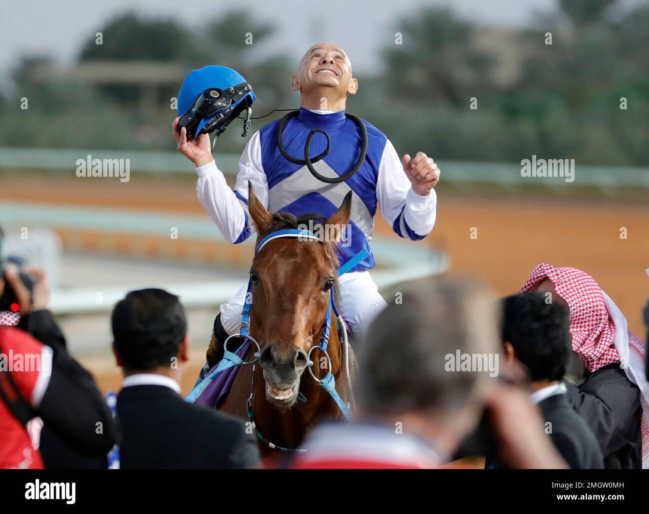Jockey Mike Smith celebrates with his horse, Paris, after he wins the