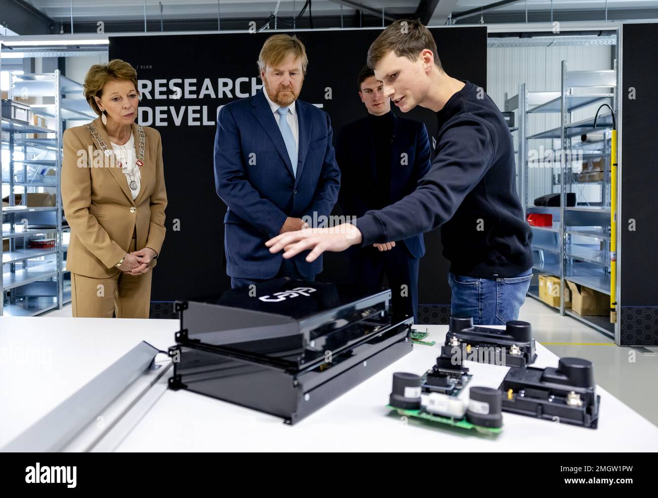 HELMOND - King Willem-Alexander is given a guided tour during the opening of ELEO's new battery factory on the Automotive Campus. ELEO designs and builds high-quality battery systems. ANP ROBIN VAN LONKHUIJSEN netherlands out - belgium out Stock Photo
