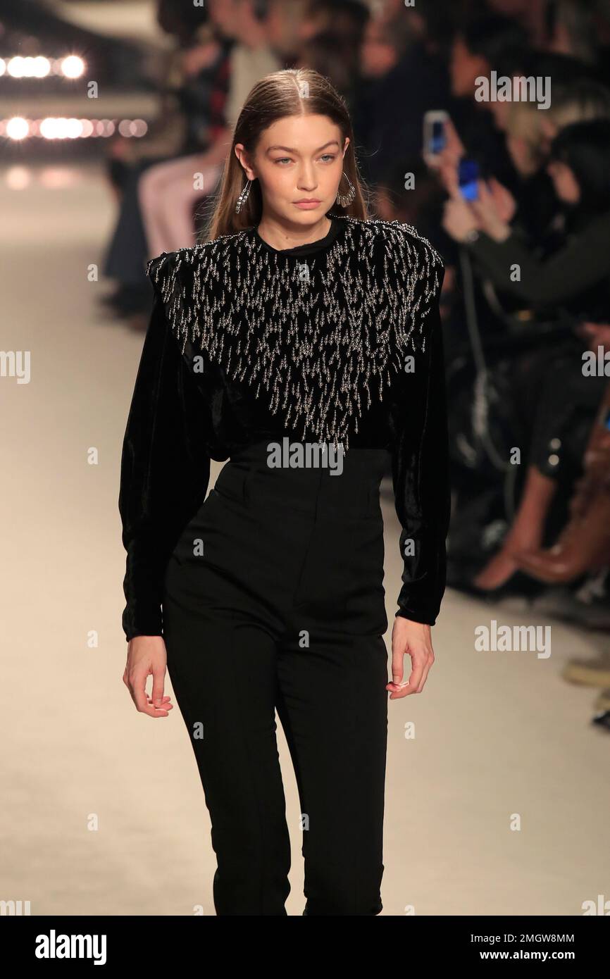 Model Gigi Hadid wears a creation for the Isabel Marant fashion ...