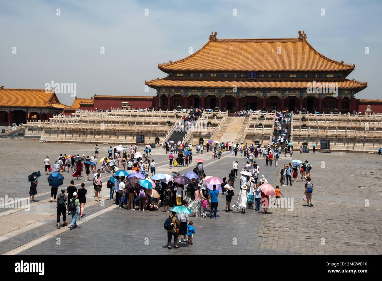 Beijing, China , June 5 2018: Crowd of Tourist People with umbrellas at the entrance of the famous Forbidden palace city in Beijing, China Stock Photo