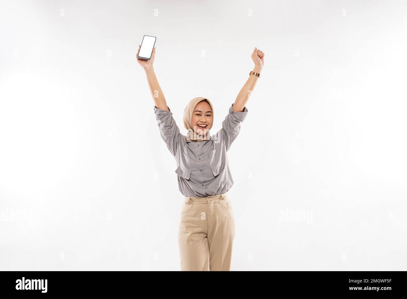 a beautiful woman with hijab standing raising her arms Stock Photo - Alamy