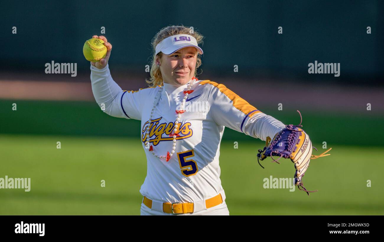LSU player Kara Goff wears Mardi Gras beads as she warms up before an