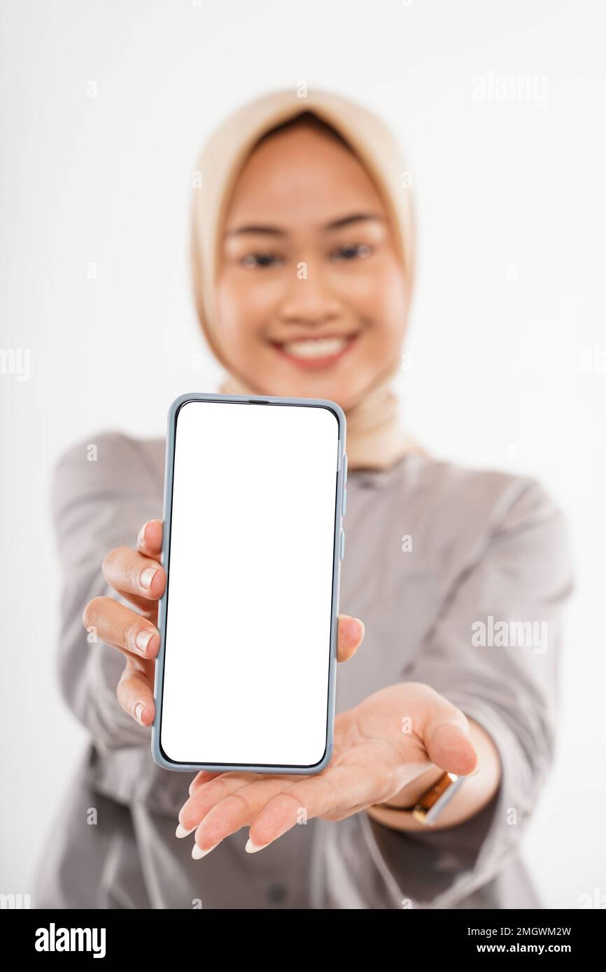 a beautiful woman with hijab standing and showing the phone Stock Photo ...