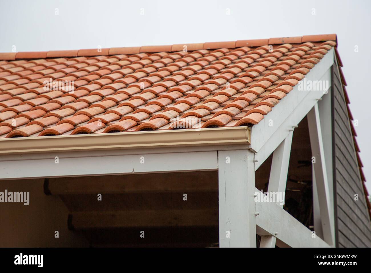 Gutter on garage house roof rain gutters on a home Stock Photo Alamy