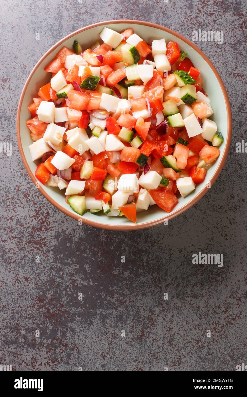 Bahamian Conch Salad taste of the Caribbean with refreshing raw seafood dish closeup on the plate on the table. vertical top view from above Stock Photo
