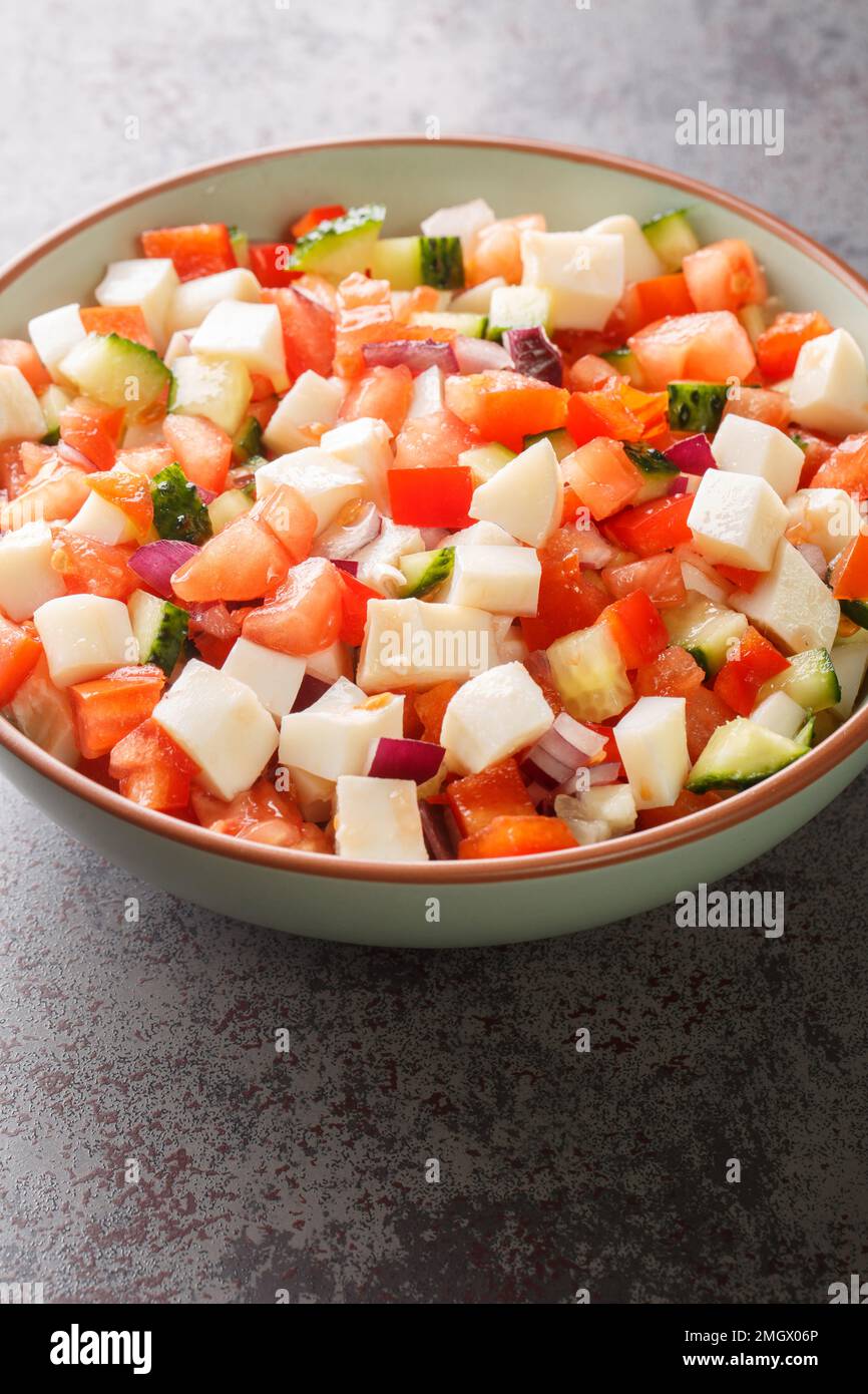 Bahamian Conch Salad taste of the Caribbean with refreshing raw seafood dish closeup on the plate on the table. vertical Stock Photo