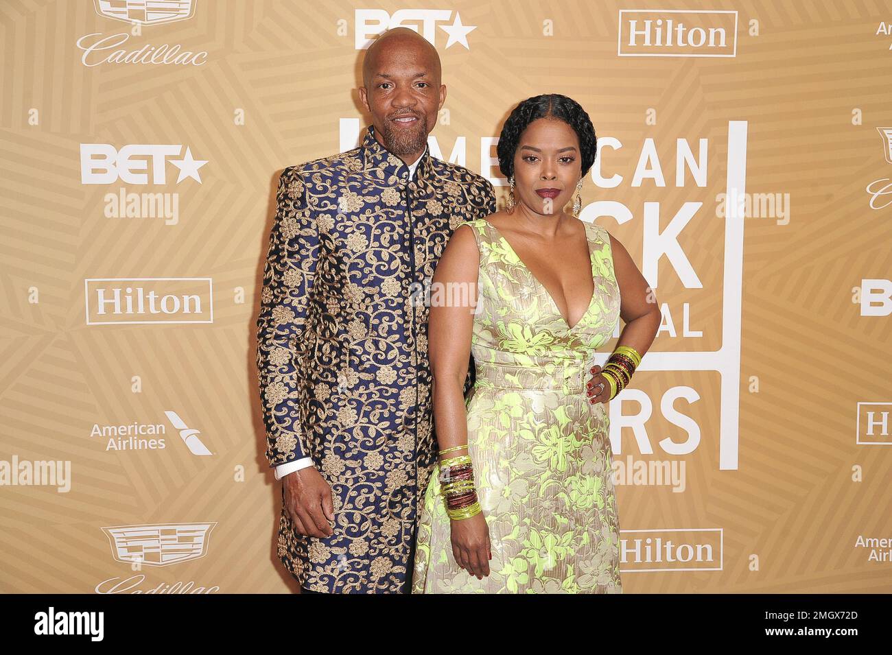 Tariq Walker, left, and Malinda Williams attend the American Black Film