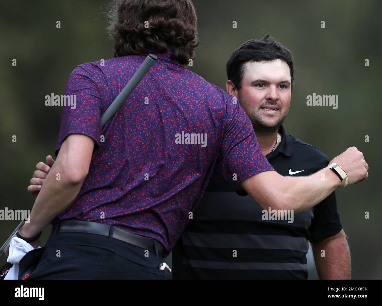Patrick Reed of the United States, right, is congratulated after ...