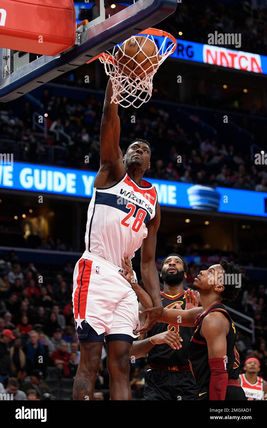 Washington Wizards center Ian Mahinmi (28) dunks over Cleveland