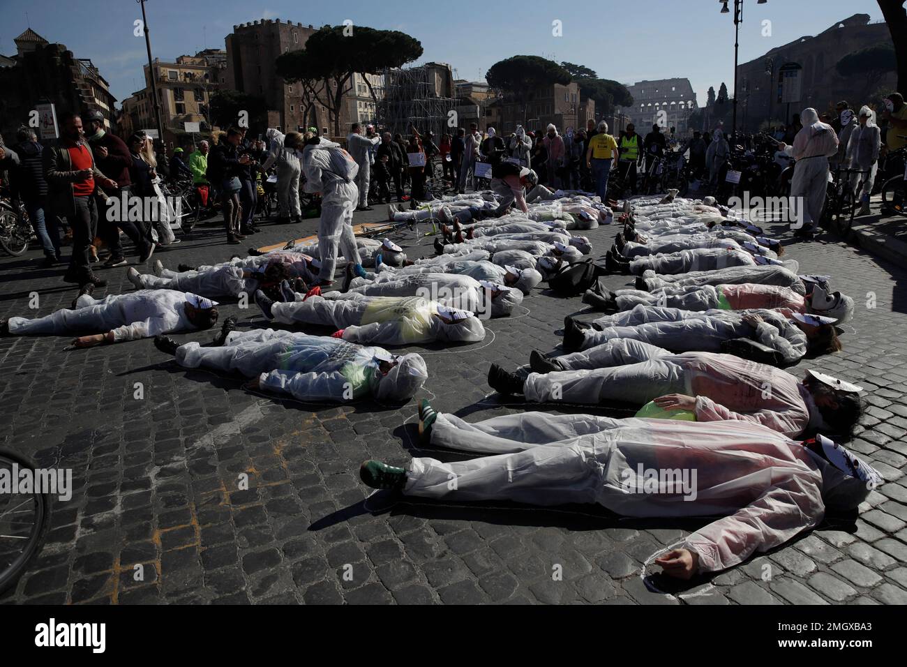 People lay on the asphalt to remember the victims of road accidents