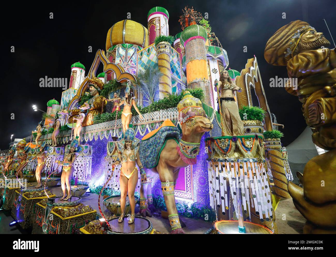 Dancers from the Perola Negra samba school perform on a float during a ...