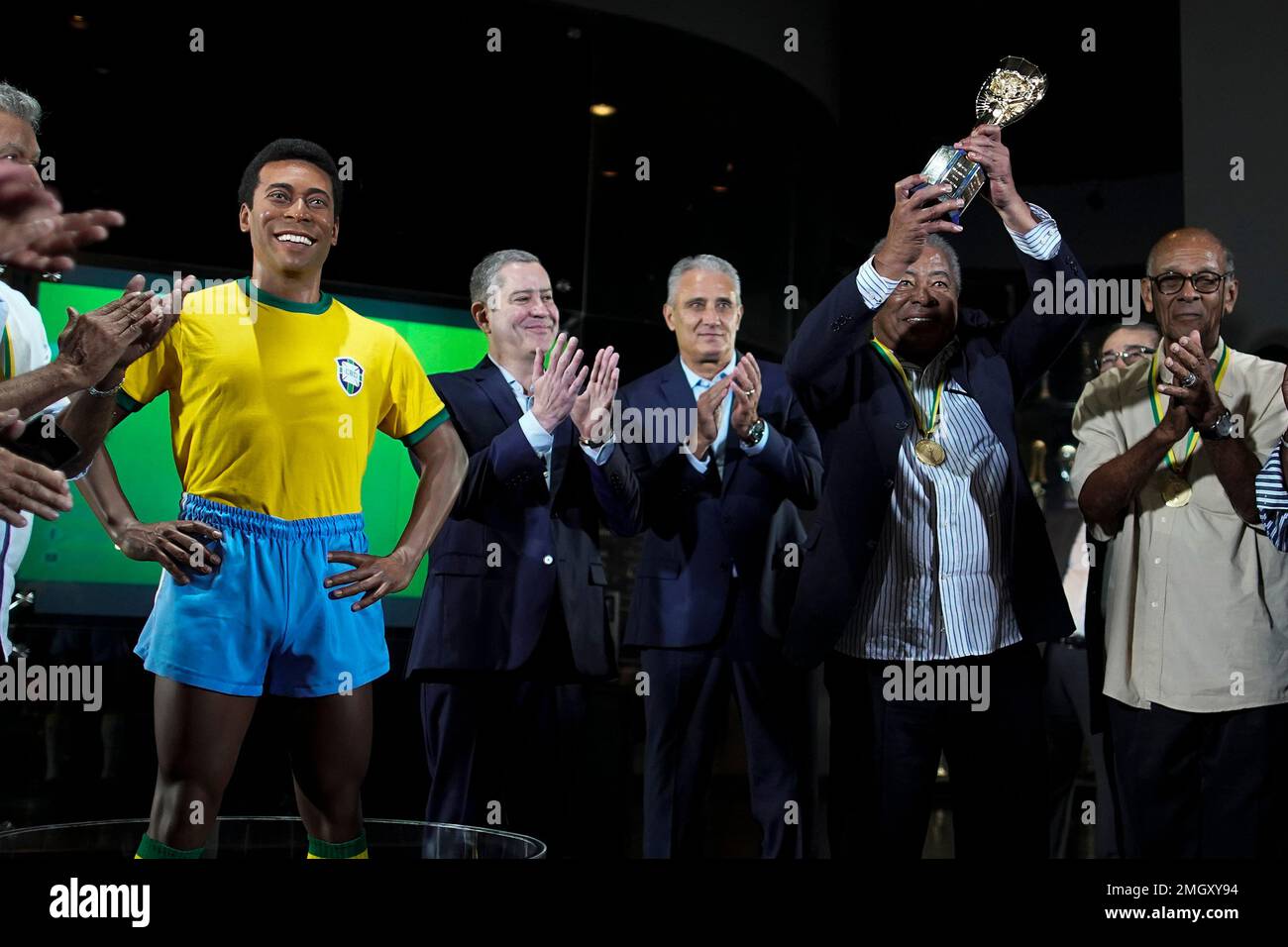 Legendary former Brazilian player Jairzinho holds up the Jules Rimet