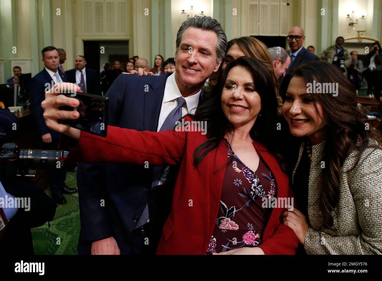 California Gov. Gavin Newsom poses for a photo with Los Angeles