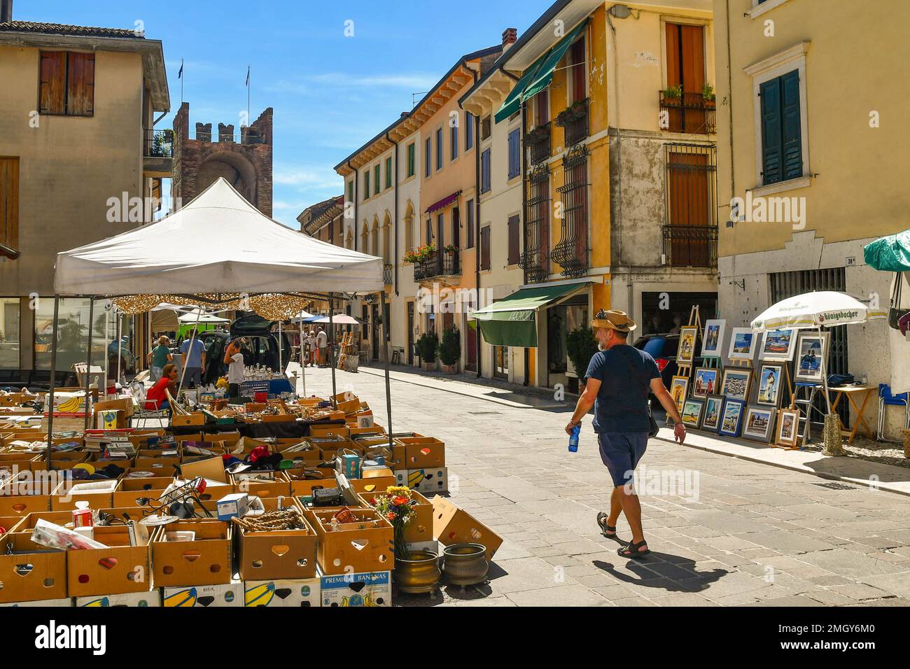 Antiques market in the main street of Soave with Porta Verona city gate in the background in summer, Verona, Veneto, Italy Stock Photo