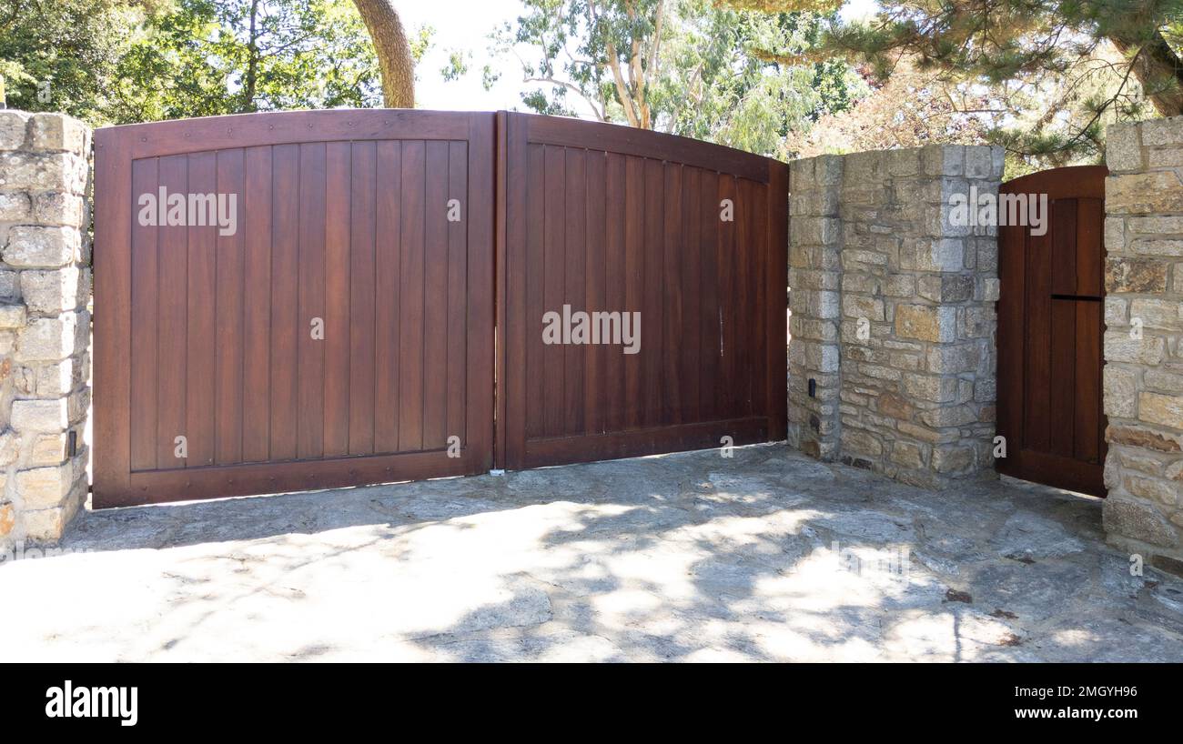 Brown wood gate private house suburb wooden portal access home door Stock Photo