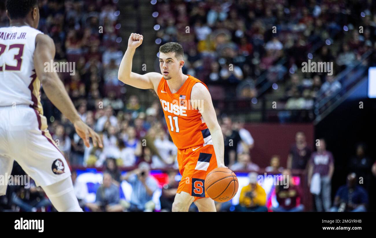Syracuse guard Joseph Girard III (11) signals the play against Florida