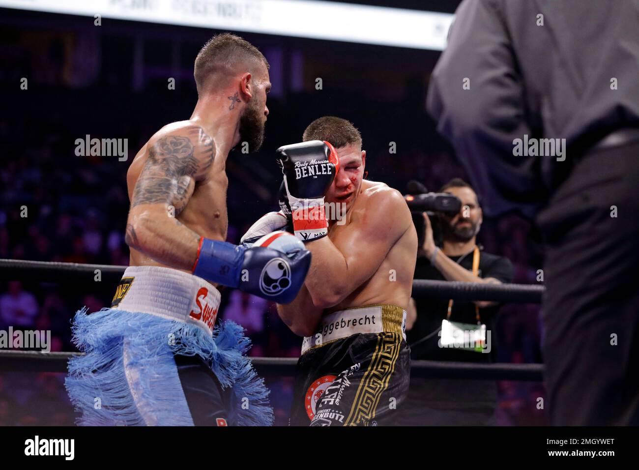 Caleb Plant, left, fights Vincent Feigenbutz, of Germany, during the ...