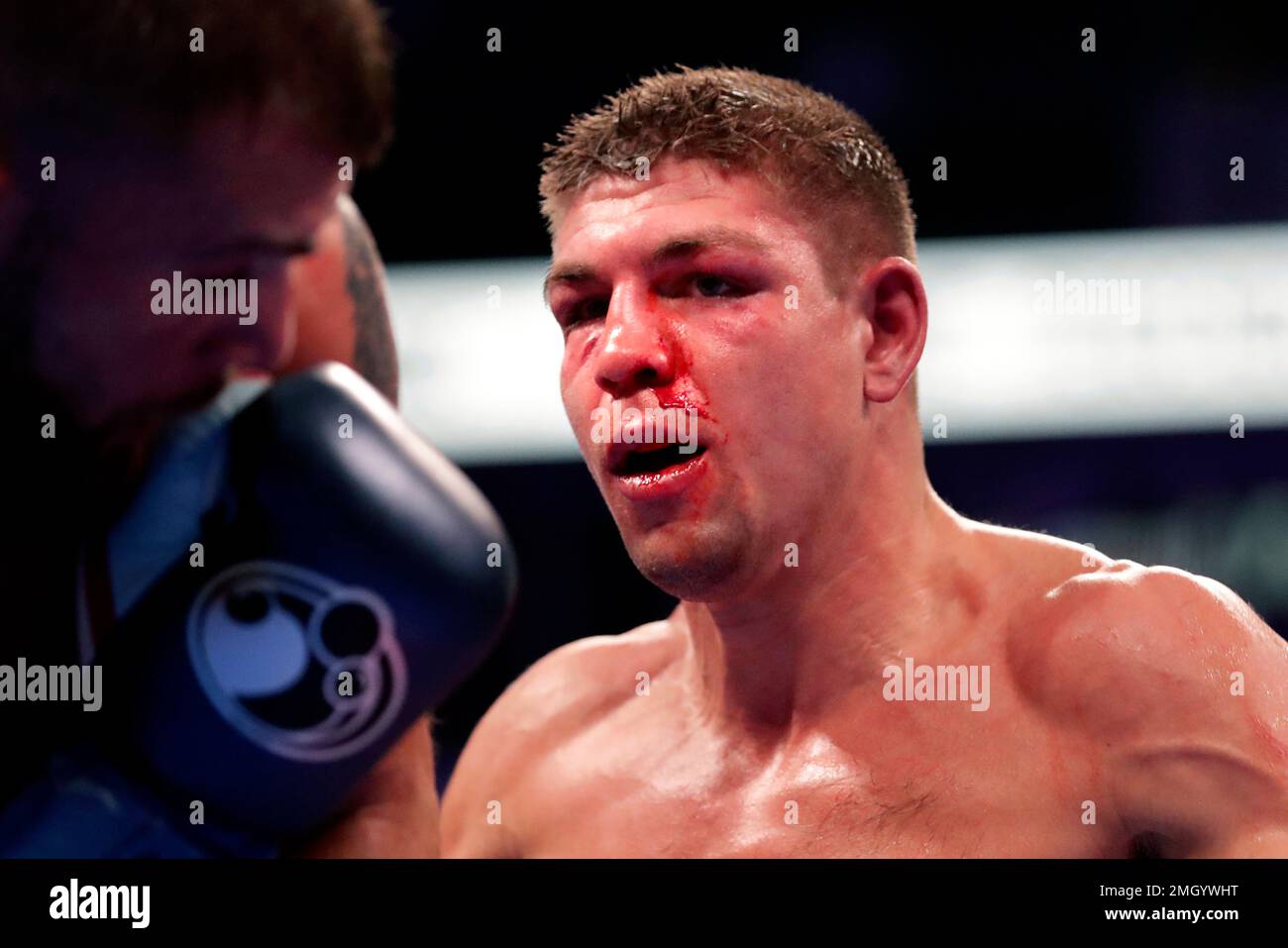 Vincent Feigenbutz, of Germany, shows a bloody nose as he fights Caleb Plant,  left, during the IBF super middleweight championship boxing match Saturday,  Feb. 15, 2020, in Nashville, Tenn. (AP Photo/Mark Humphrey