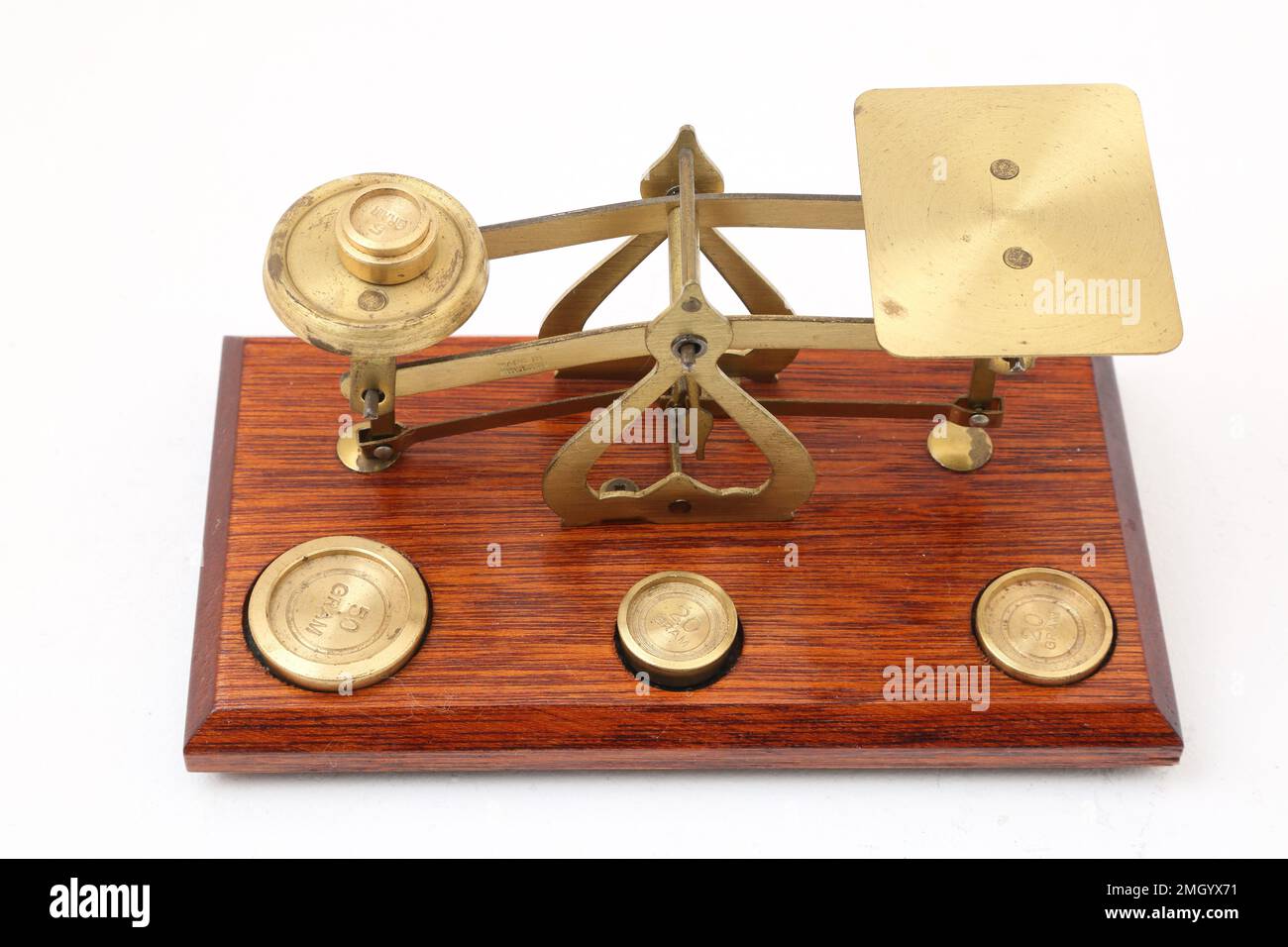 Vintage Brass and Wooden Weighing Scales with Weights Stock Photo