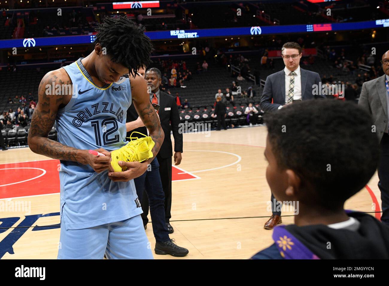 The shoes of Memphis Grizzlies guard Ja Morant are shown as he plays  against the Dallas Mavericks in an NBA basketball game in Dallas, Sunday,  Jan. 23, 2022. (AP Photo/Tony Gutierrez Stock
