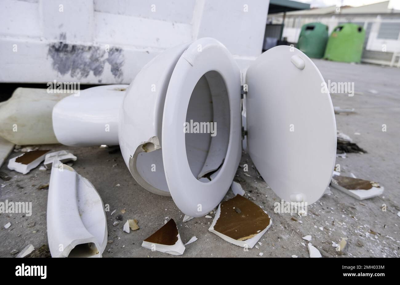 Detail of toilet in the garbage, destruction and vandalism in the street Stock Photo