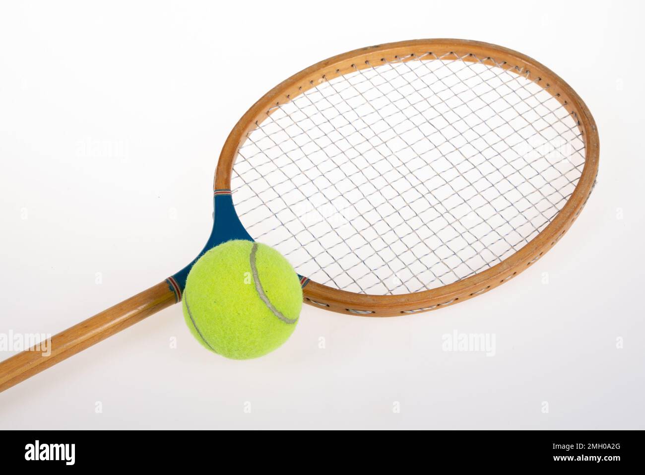 Vintage Tennis Racket with yellow ball in grey background Stock Photo ...