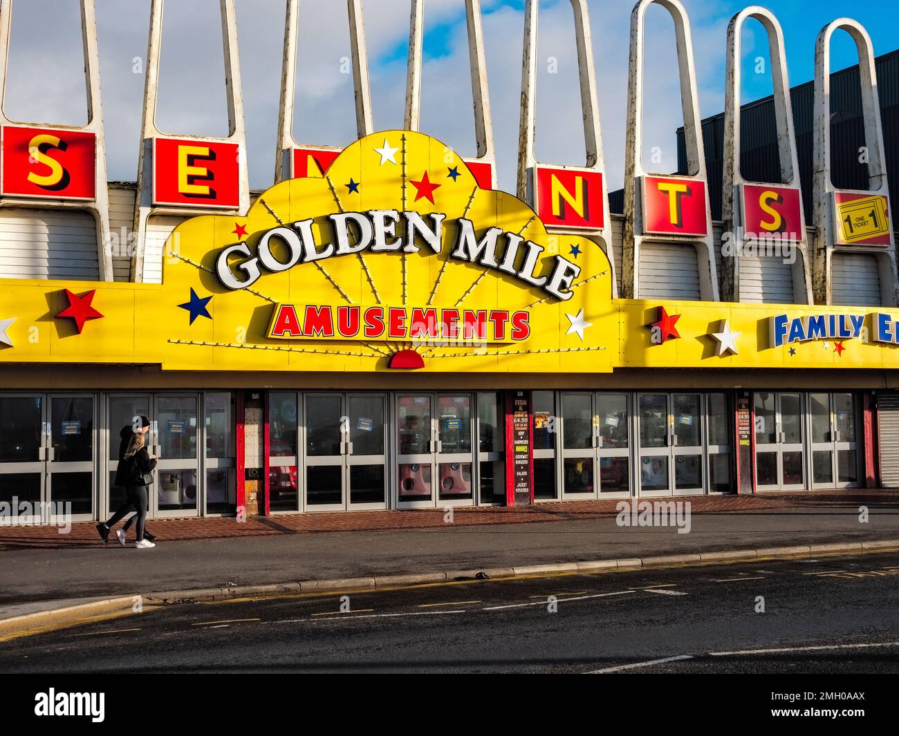 Blackpool Lancashire UK Jan 2023 Golden mile brightly colored amusement arcade on the sea front in the holiday town Stock Photo