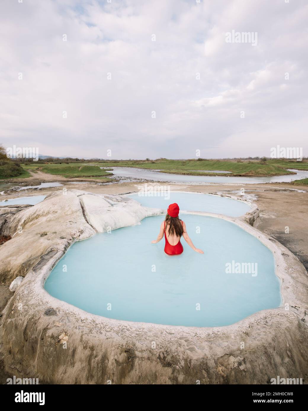 The girl bathes in a natural hot spring in Stock Photo Alamy