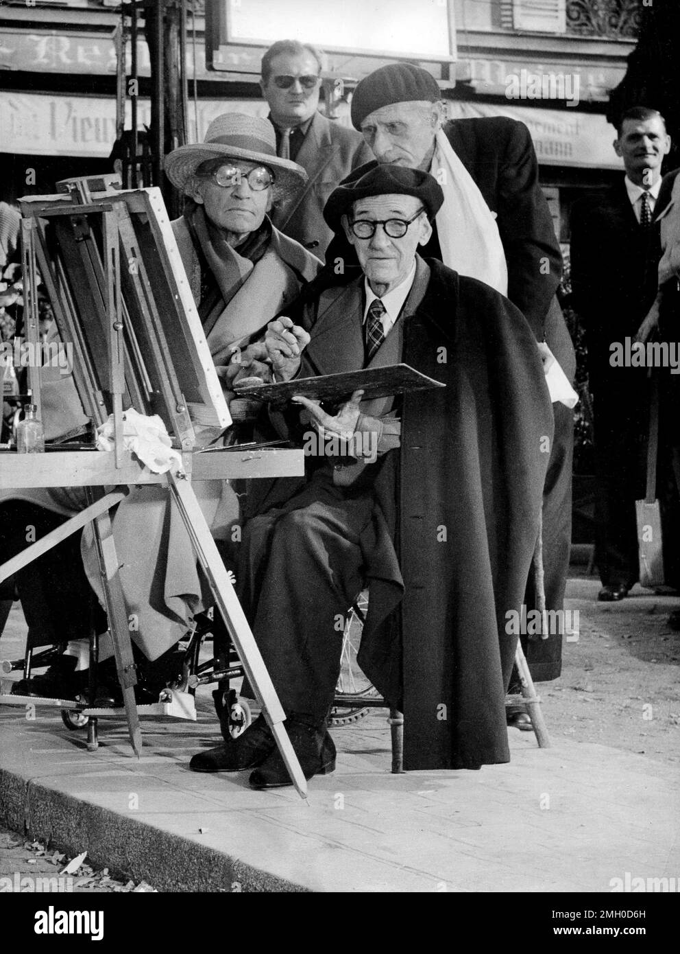 French painter Maurice Utrillo is observed by Sacha Guitry and Paul