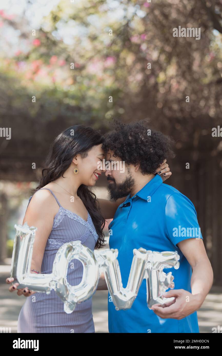 face to face Mexican young couple, real love Stock Photo