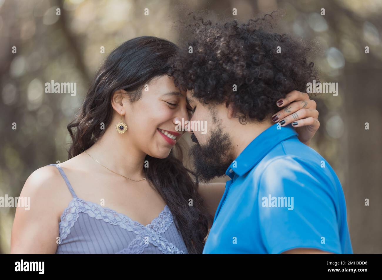 face to face Mexican young couple, real love concept Stock Photo