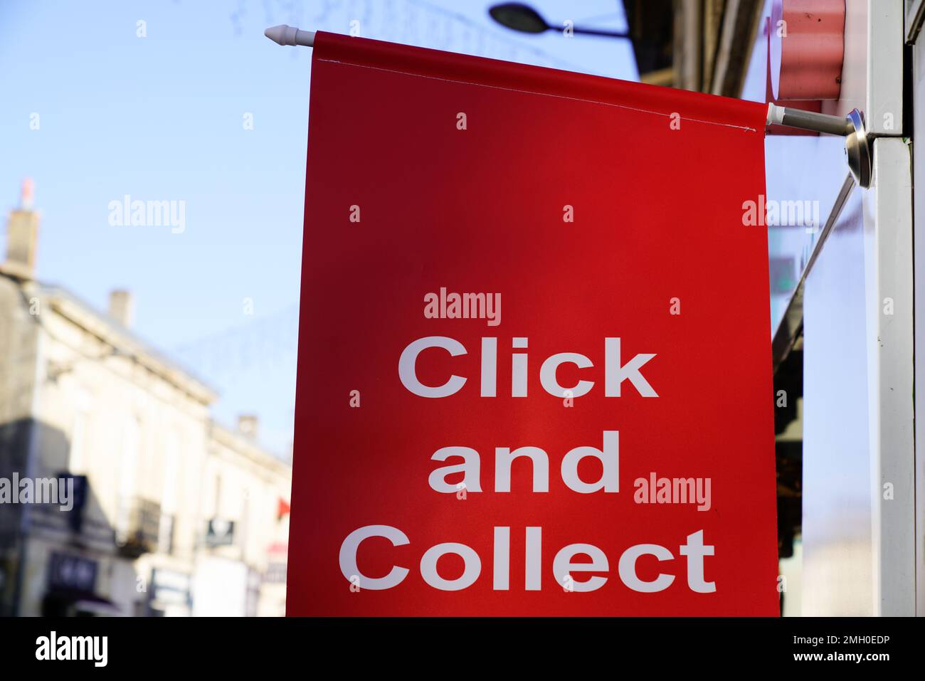 Click and Collect flag sign on shop street order shopping online and