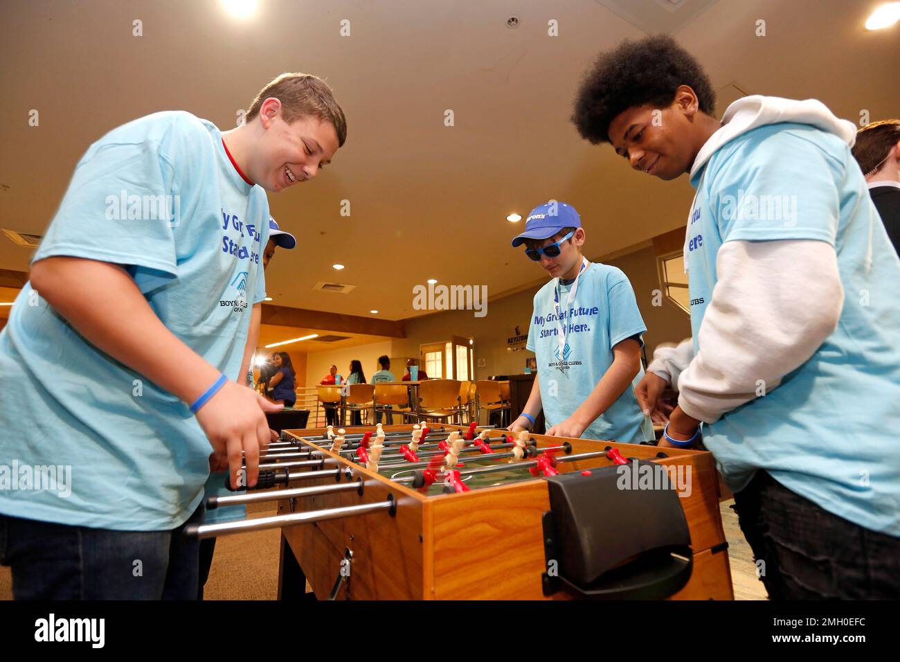 IMAGE DISTRIBUTED FOR AARON'S INC. Teens play on the new foosball table provided as part of