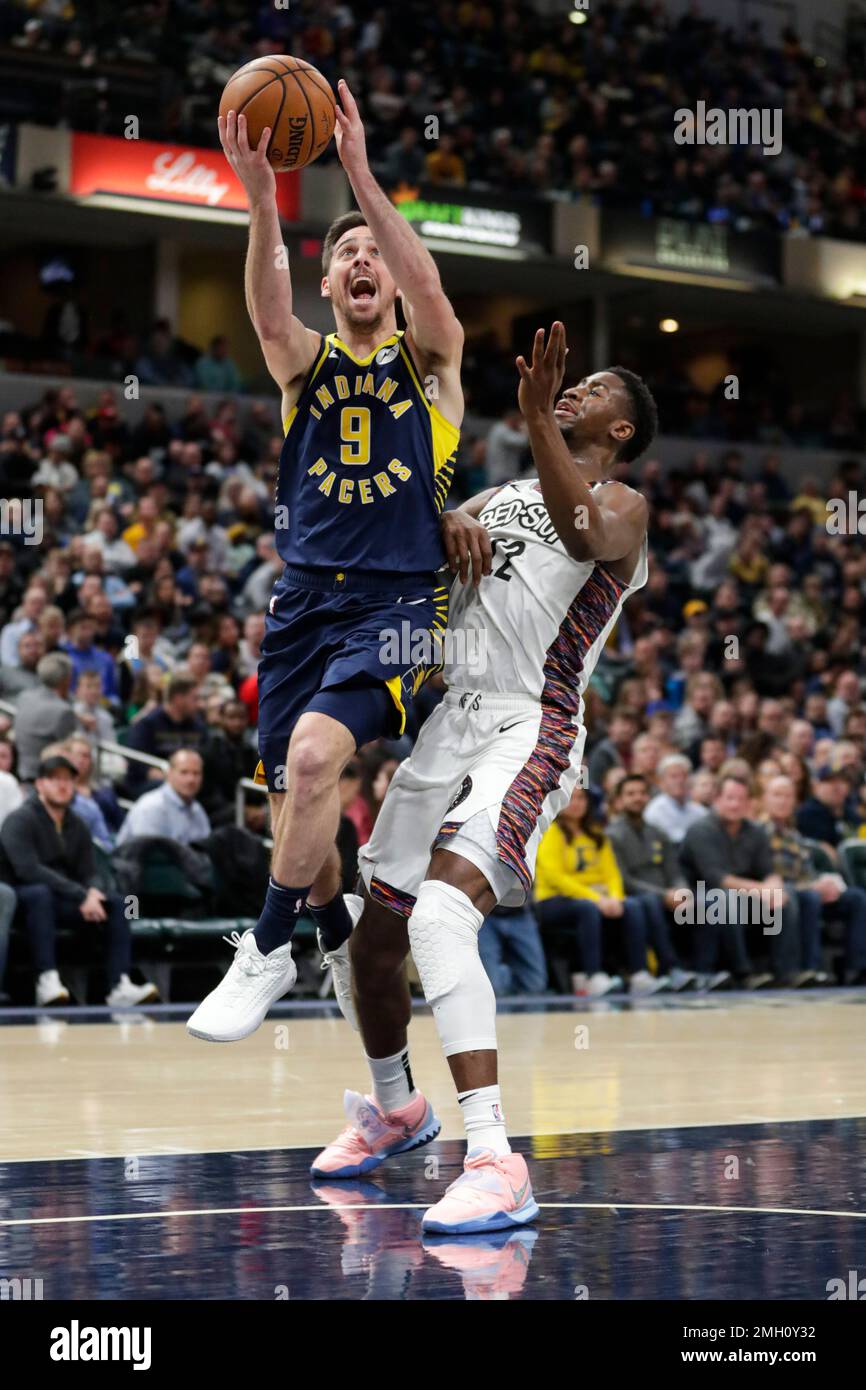 Indiana Pacers guard T.J. McConnell (9) shoots over Brooklyn Nets guard ...