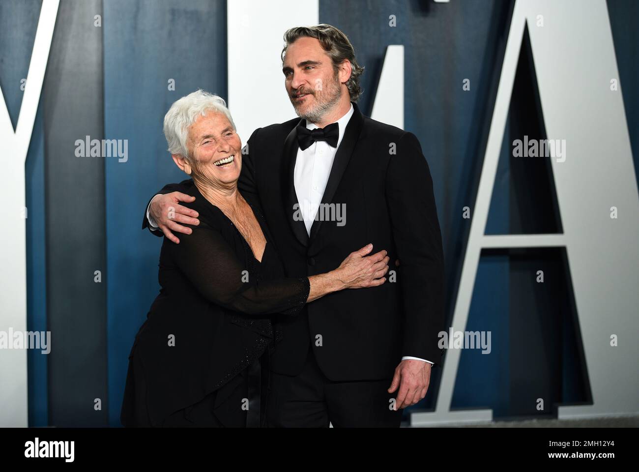Joaquin Phoenix, right, and Arlyn Phoenix arrive at the Vanity Fair